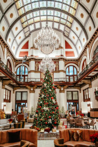 a Christmas tree in a hotel lobby