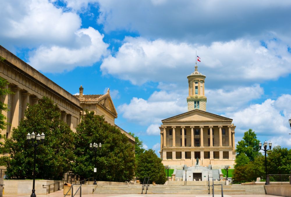 The Tennessee State Capitol building with a clear blue sky