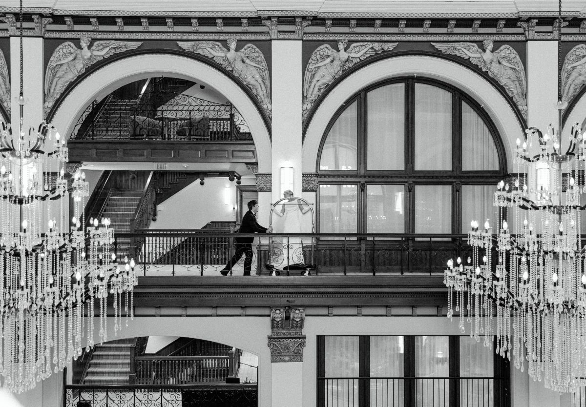 Bride and groom in historic hotel lobby